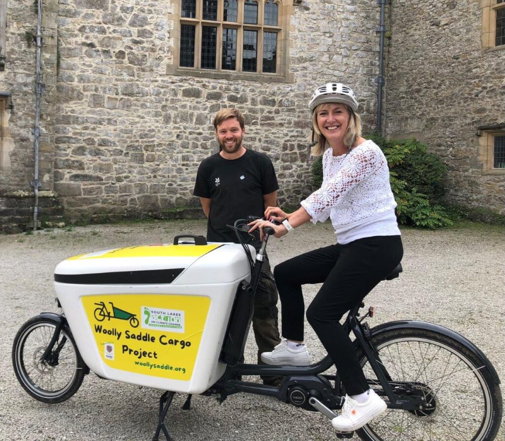 National Trust Ranger Sam and Director General Hilary trying the cargo bike at Sizergh Castle